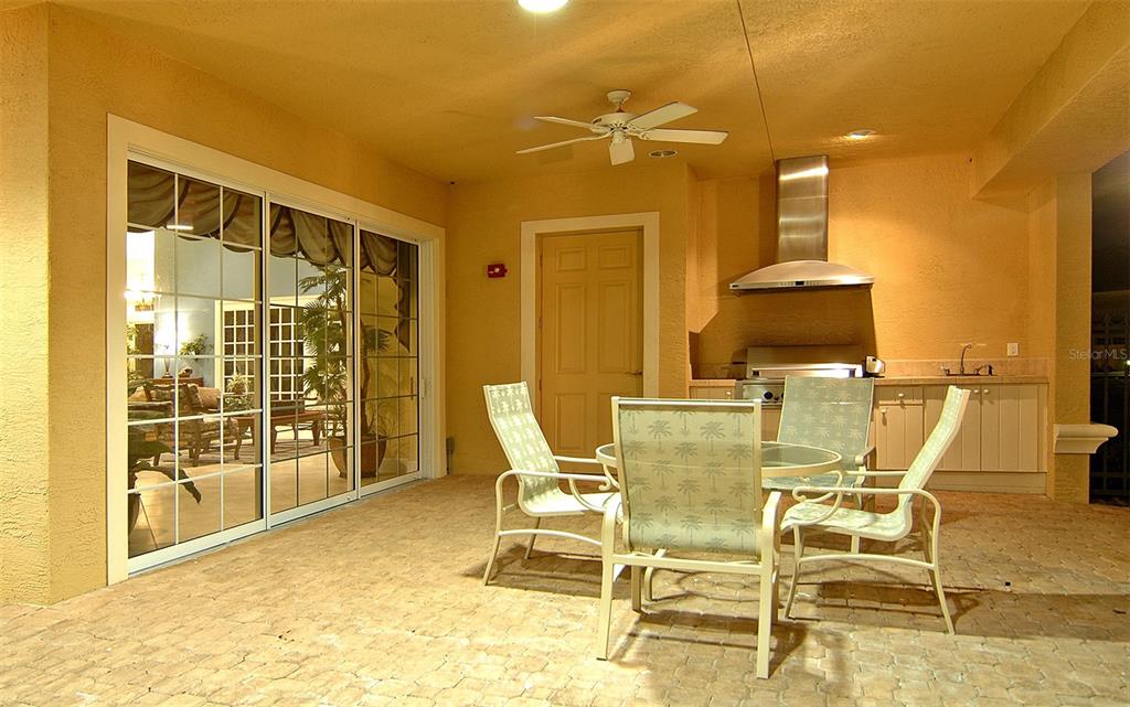 8363 Miramar Way, Unit 203 Lakewood Ranch, FL 34202 - Photo 65 of 73 a view of a dining room with furniture and a chandelier