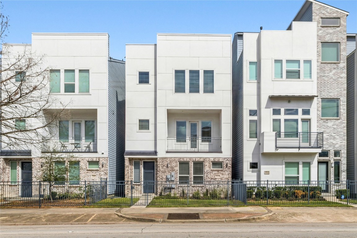 Modern townhome with gated front yard and street-facing charm on Elgin Street.