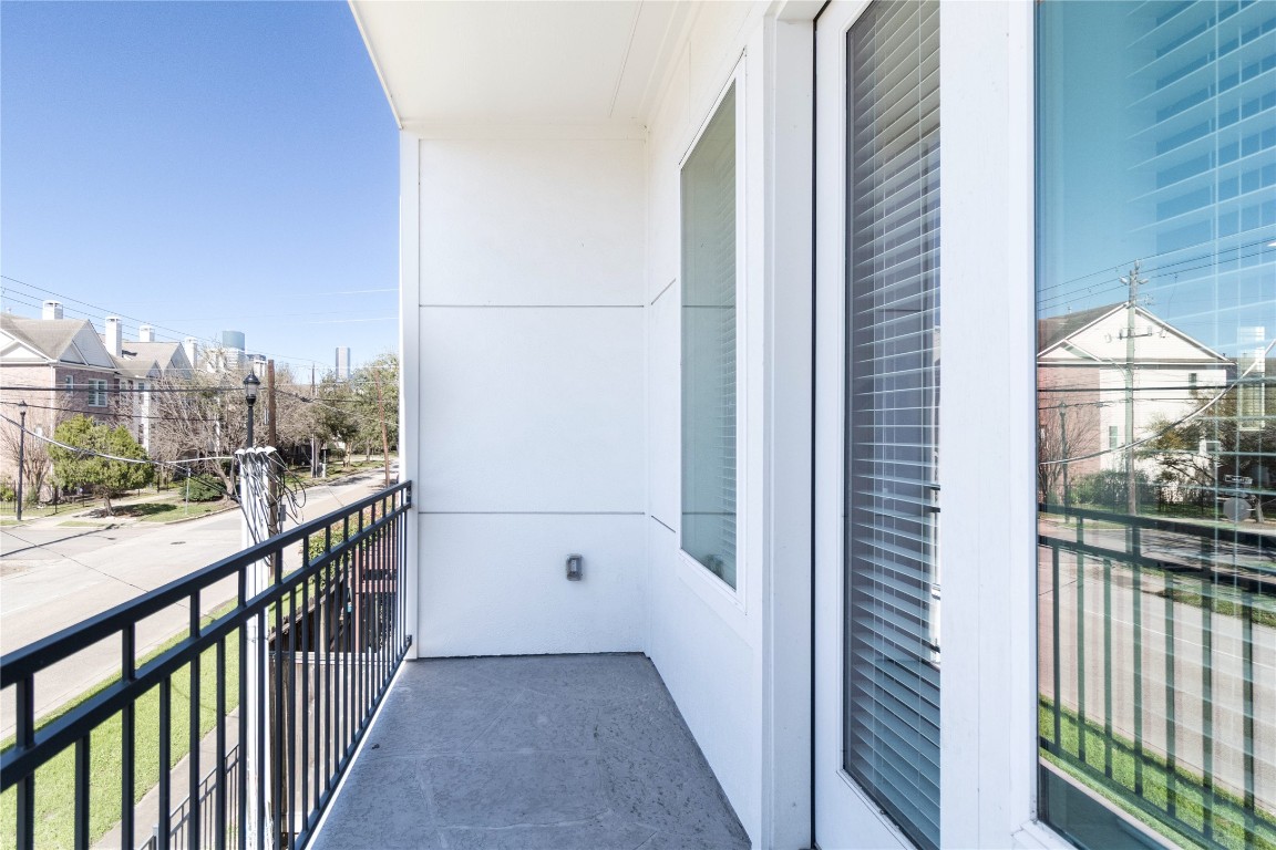 1509 Elgin Street Houston, TX 77004 - Photo 15 of 34 Elevate your living experience with a charming second-floor balcony off the living room.