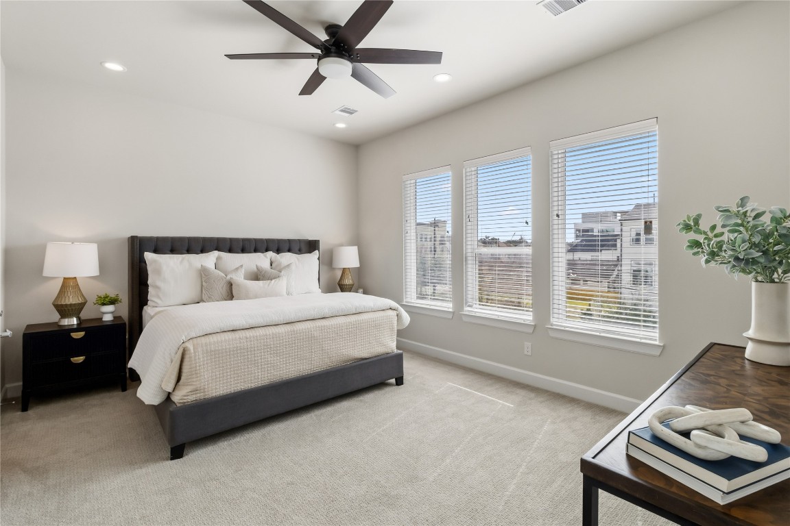 1509 Elgin Street Houston, TX 77004 - Photo 20 of 34 Expansive primary bedroom on the third floor with ample natural light. *staged photo