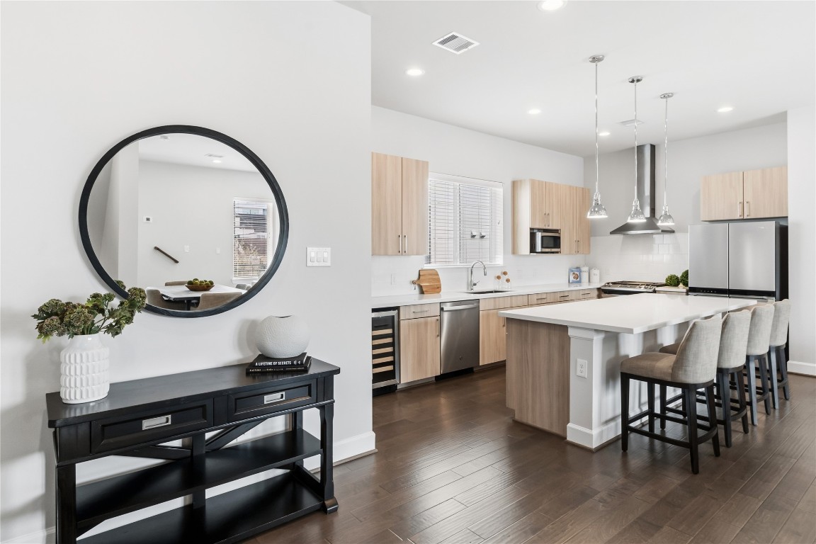 1509 Elgin Street Houston, TX 77004 - Photo 6 of 34 Step upstairs to discover a spacious open-concept kitchen, dining, and living area. *staged photo