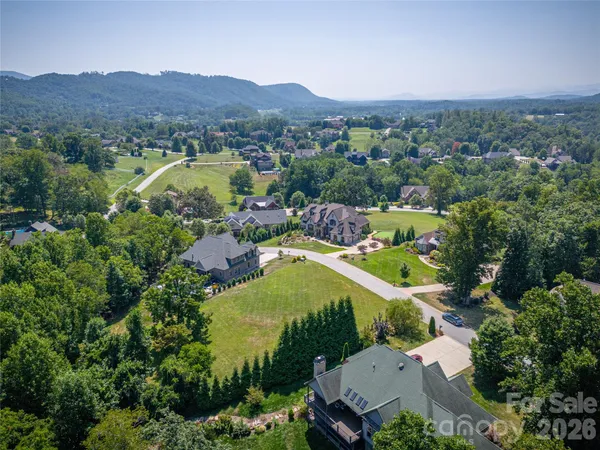 an aerial view of a house with mountain view