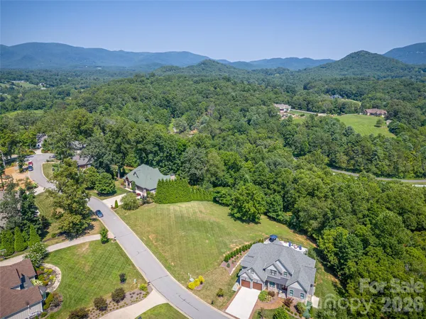 a view of a back yard from a balcony