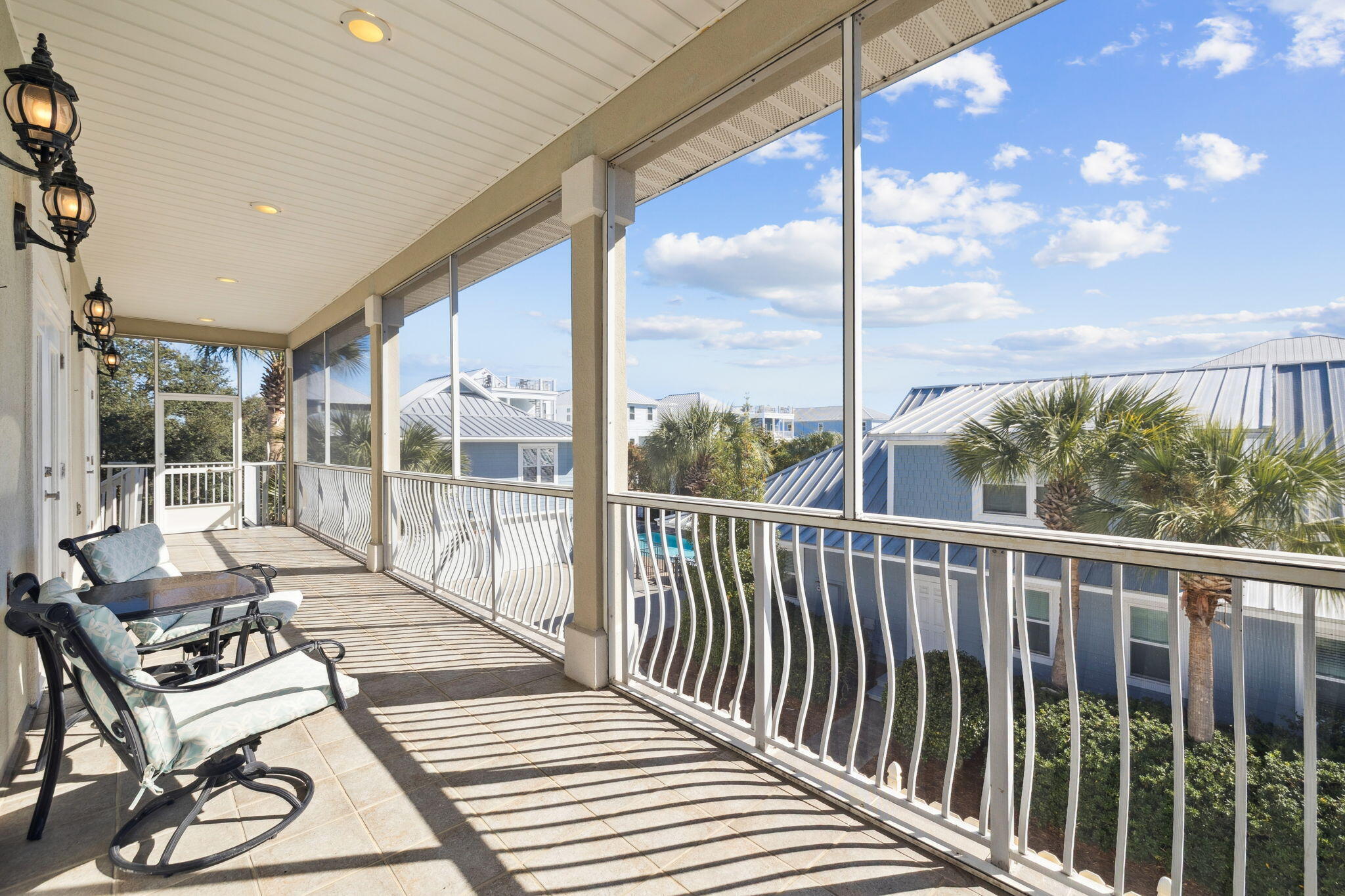 111 Snowdrift Road Miramar Beach, FL 32550 - Photo 27 of 32 a balcony with wooden floor next to a yard