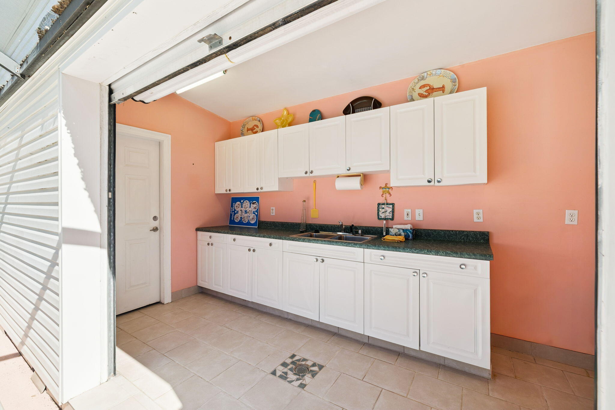 111 Snowdrift Road Miramar Beach, FL 32550 - Photo 29 of 32 a kitchen with granite countertop a sink and cabinets