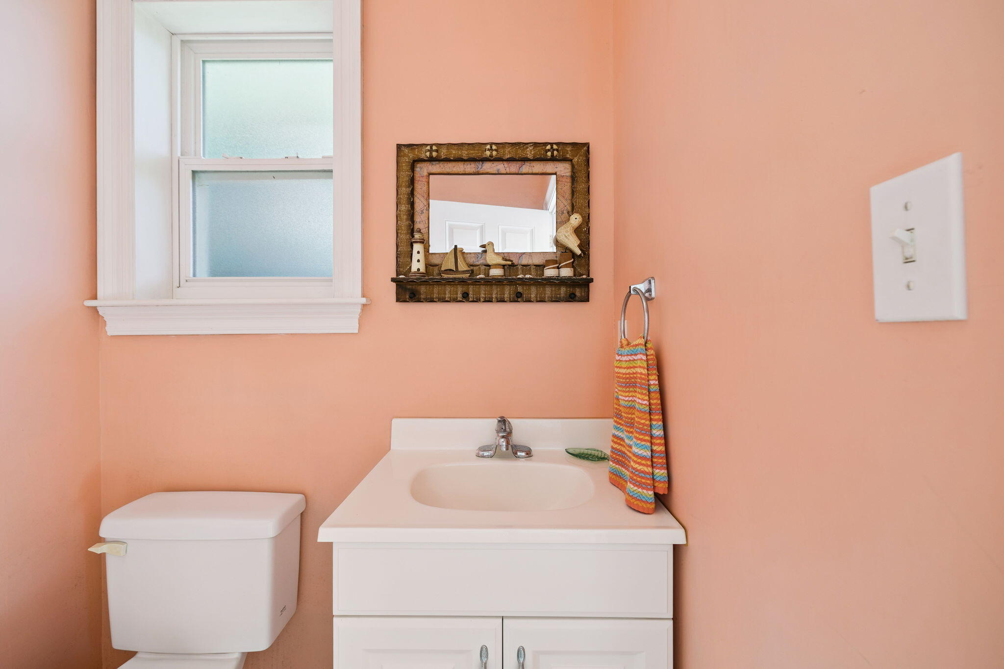111 Snowdrift Road Miramar Beach, FL 32550 - Photo 30 of 32 a bathroom with a toilet a sink and a mirror