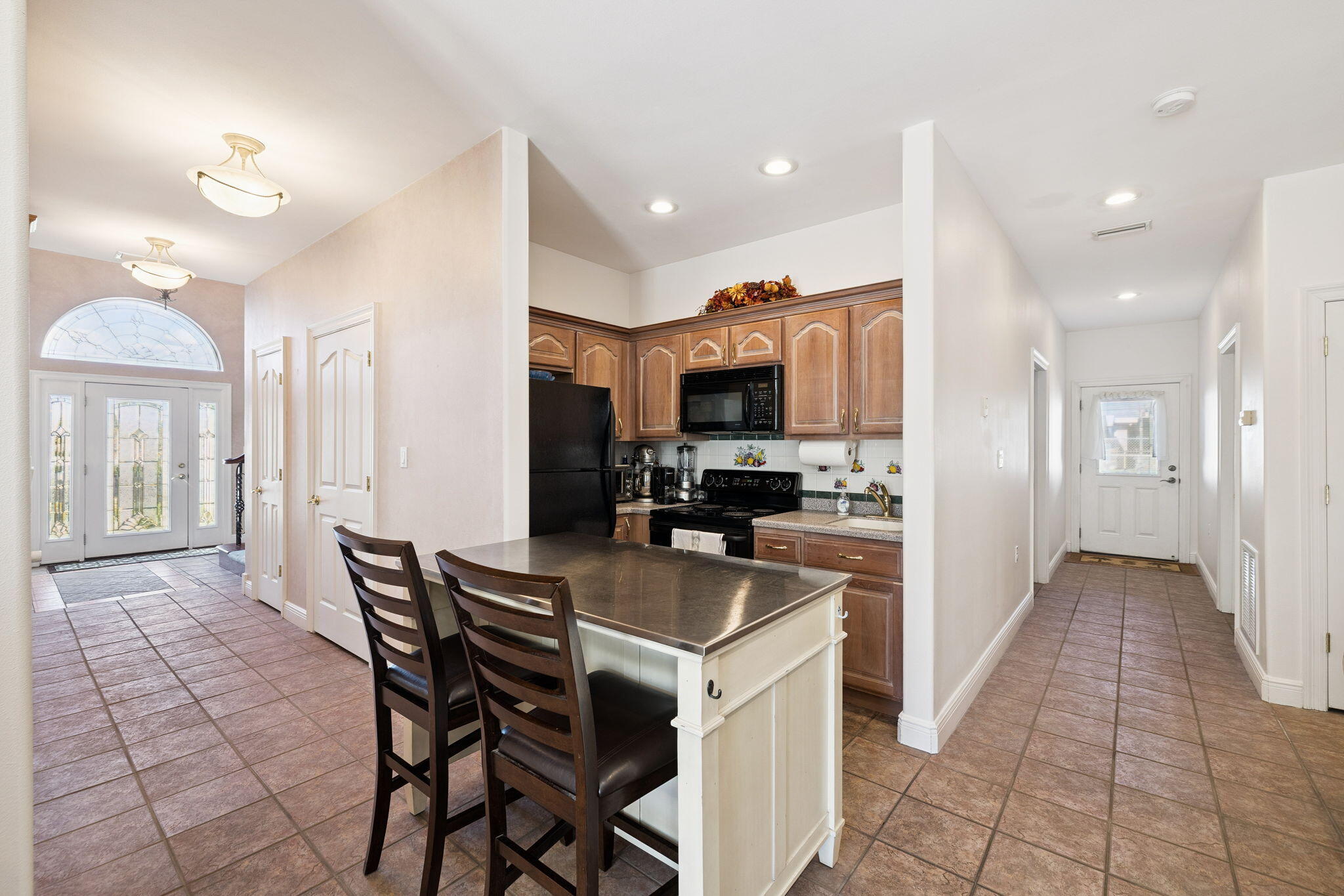 111 Snowdrift Road Miramar Beach, FL 32550 - Photo 8 of 32 a kitchen with a table and chairs in it