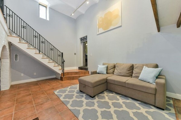 330 E Street, Unit 1 Boston, MA 02127 - Photo 12 of 24 a living room with furniture and a rug