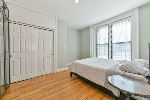 330 E Street, Unit 1 Boston, MA 02127 - Photo 17 of 24 a bedroom with a bed and a window