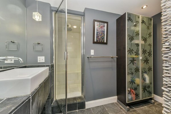 330 E Street, Unit 1 Boston, MA 02127 - Photo 18 of 24 a bathroom with a shower and a sink