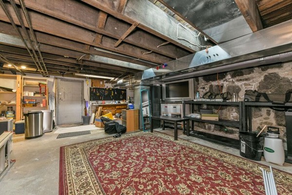 330 E Street, Unit 1 Boston, MA 02127 - Photo 23 of 24 a view of garage with couch
