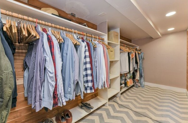 330 E Street, Unit 1 Boston, MA 02127 - Photo 24 of 24 a view of walk in closet with clothes and shoes
