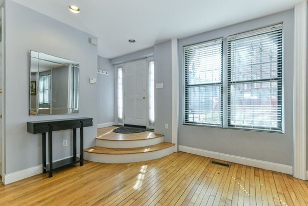 330 E Street, Unit 1 Boston, MA 02127 - Photo 4 of 24 a view of room with wooden floor and sink