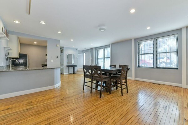 330 E Street, Unit 1 Boston, MA 02127 - Photo 6 of 24 a view of a dining room with furniture and wooden floor
