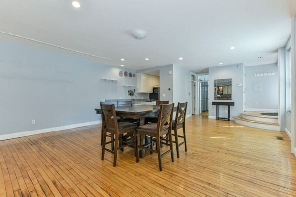 330 E Street, Unit 1 Boston, MA 02127 - Photo 7 of 24 a dining room with furniture and wooden floor