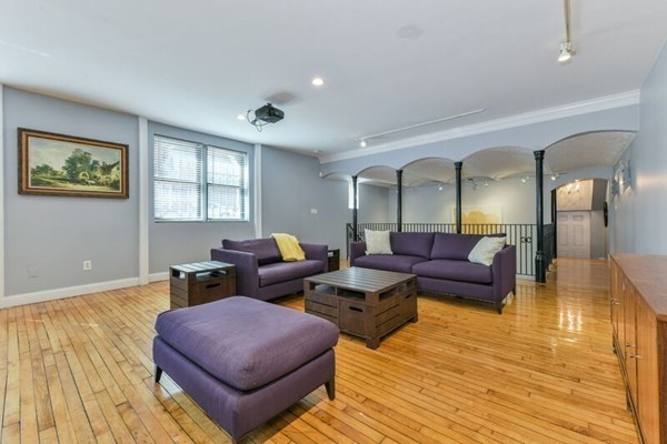 330 E Street, Unit 1 Boston, MA 02127 - Photo 9 of 24 a living room with furniture and wooden floor