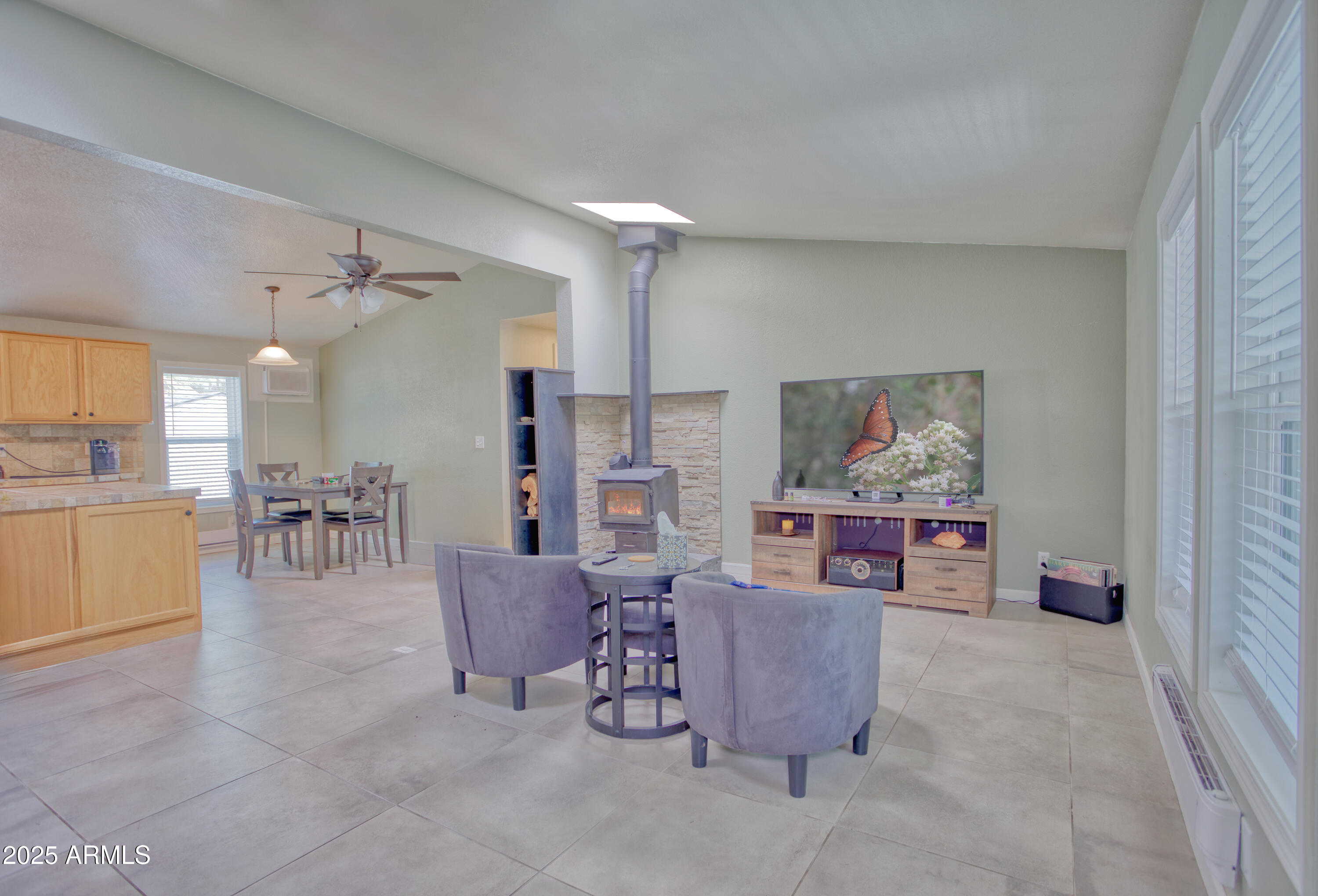 17090 Iron Springs Road Munds Park, AZ 86017 - Photo 1 of 68 a living room with furniture and kitchen view