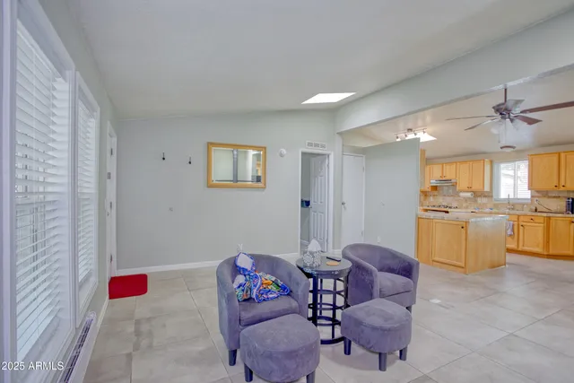 a large kitchen with sink refrigerator and cabinets