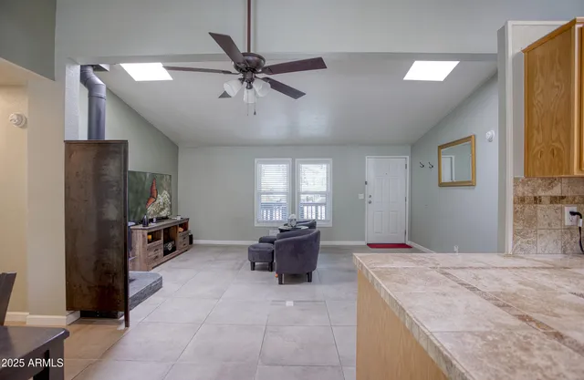 a kitchen with a sink appliances and cabinets
