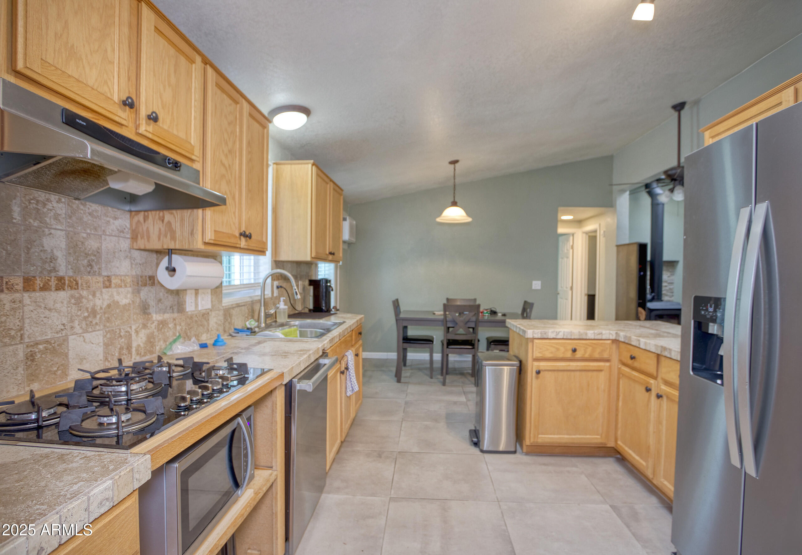 17090 Iron Springs Road Munds Park, AZ 86017 - Photo 19 of 68 a kitchen with a sink appliances and cabinets