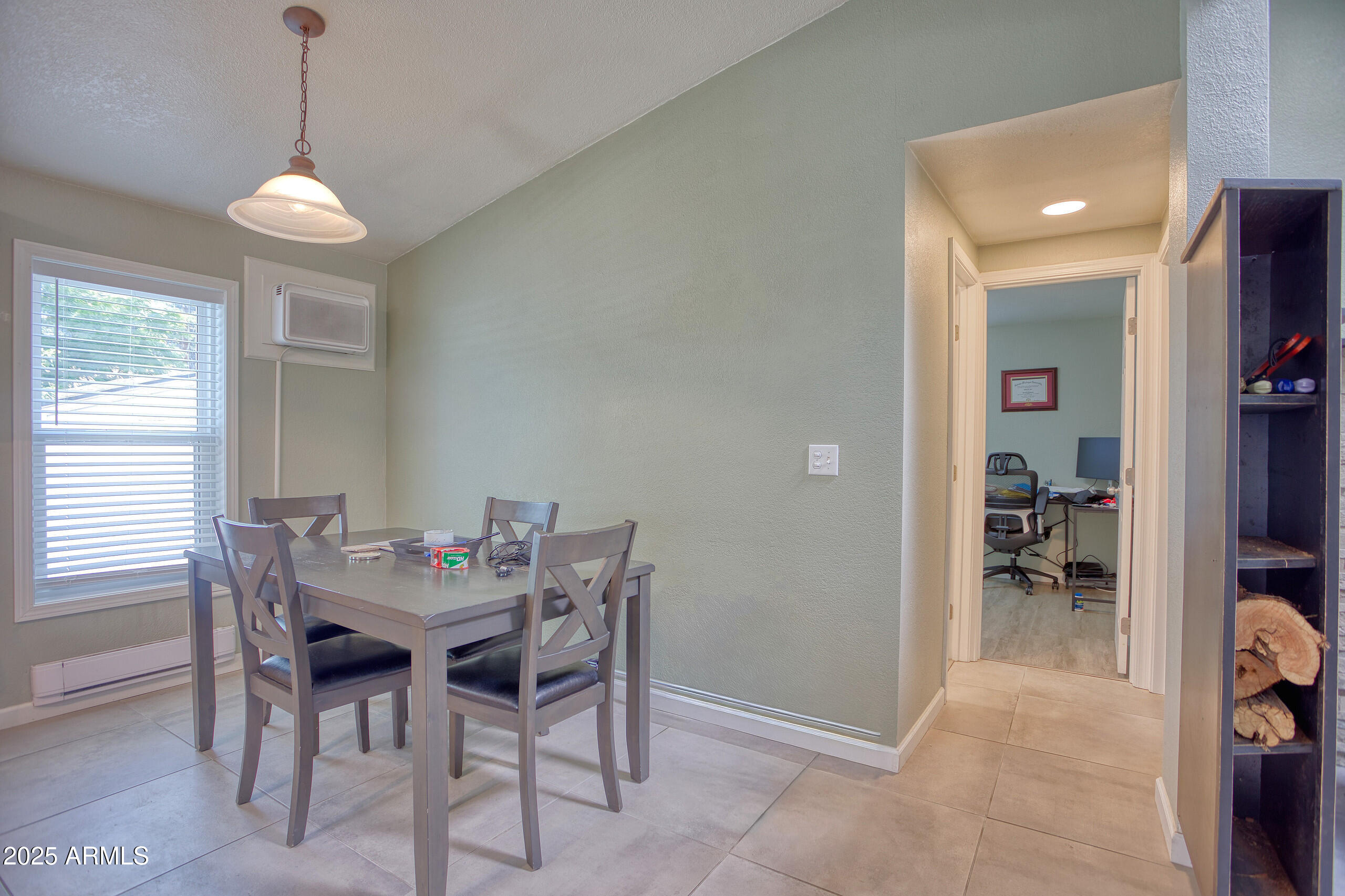 17090 Iron Springs Road Munds Park, AZ 86017 - Photo 23 of 68 a view of a dining room with furniture and chandelier