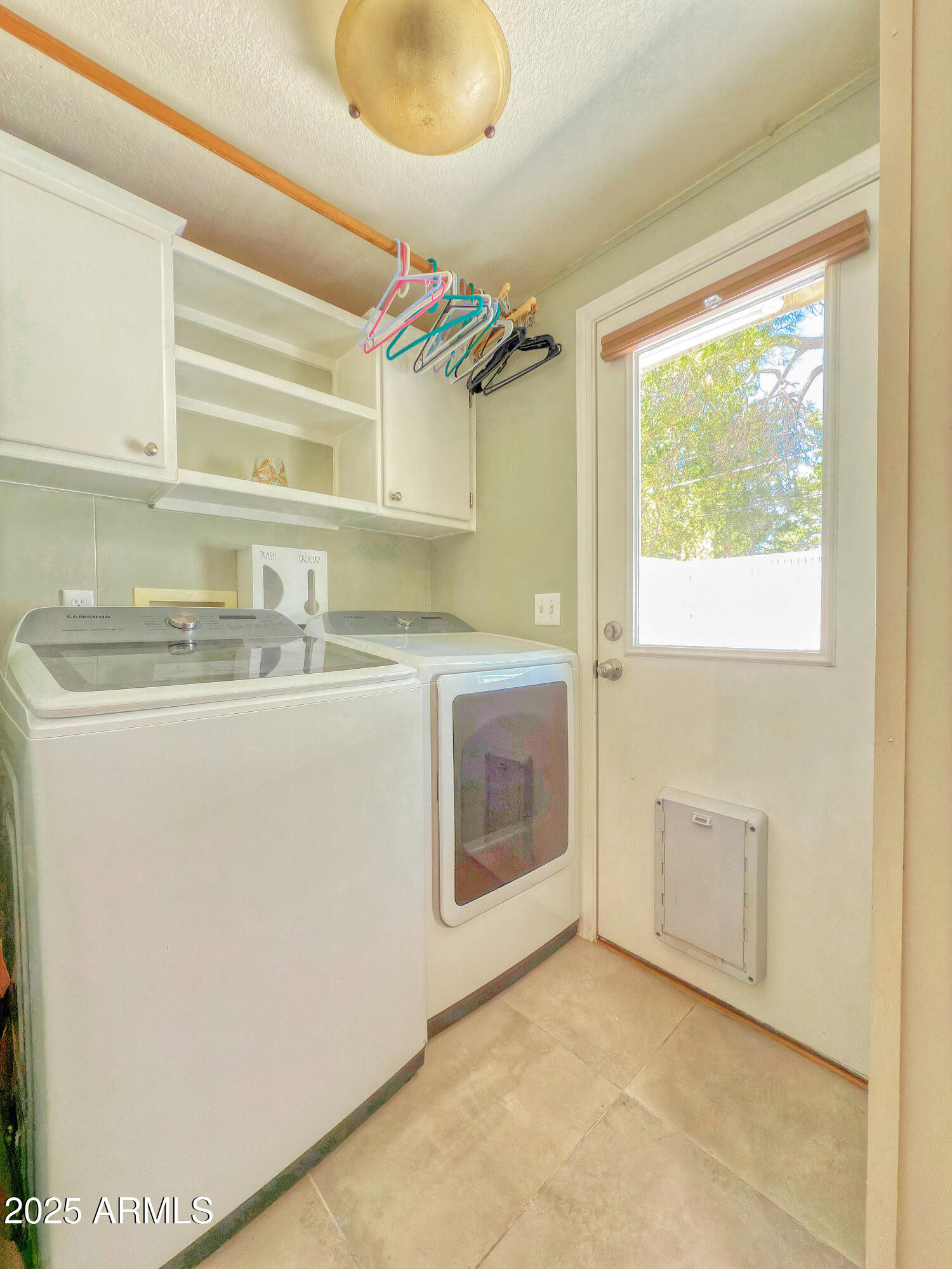 17090 Iron Springs Road Munds Park, AZ 86017 - Photo 24 of 68 a utility room with a sink a washer and dryer
