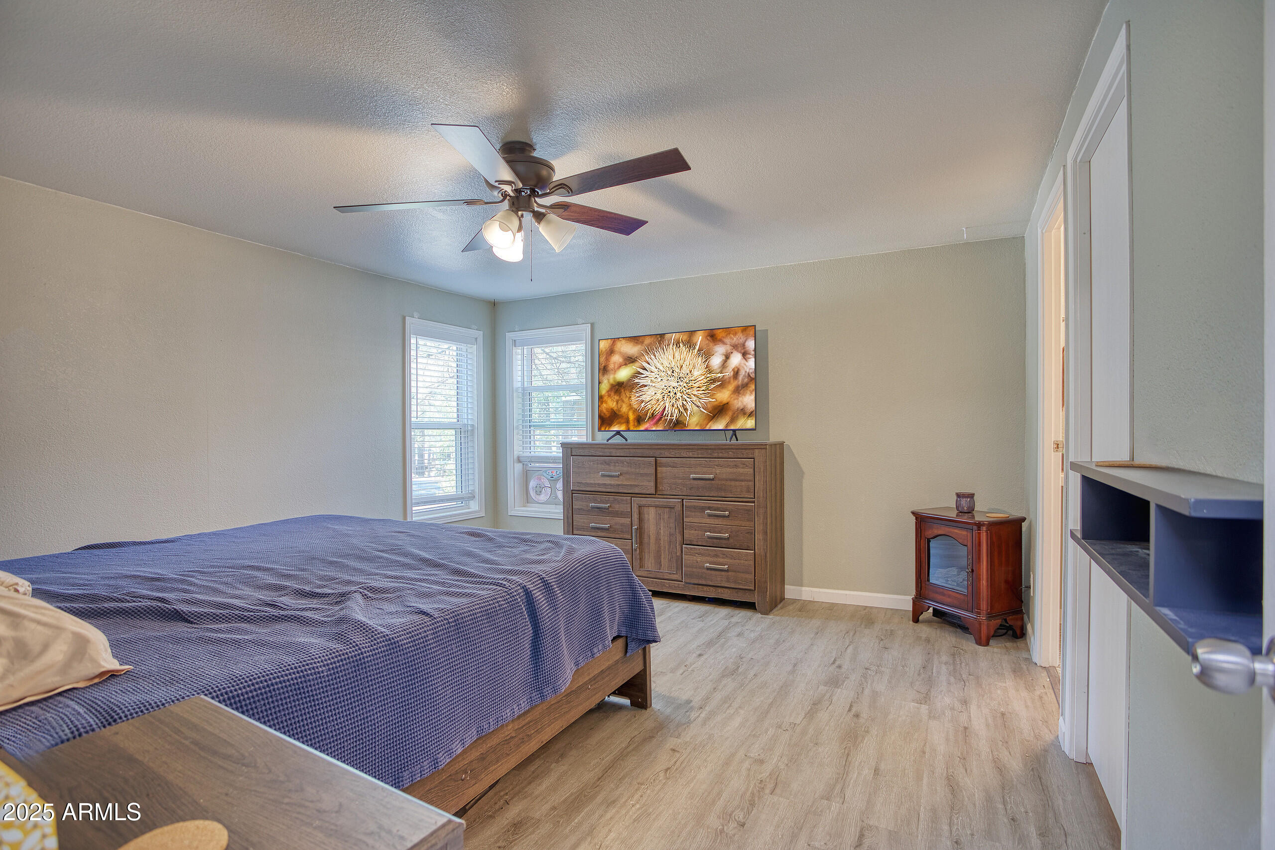17090 Iron Springs Road Munds Park, AZ 86017 - Photo 25 of 68 a bedroom with a bed and a dresser