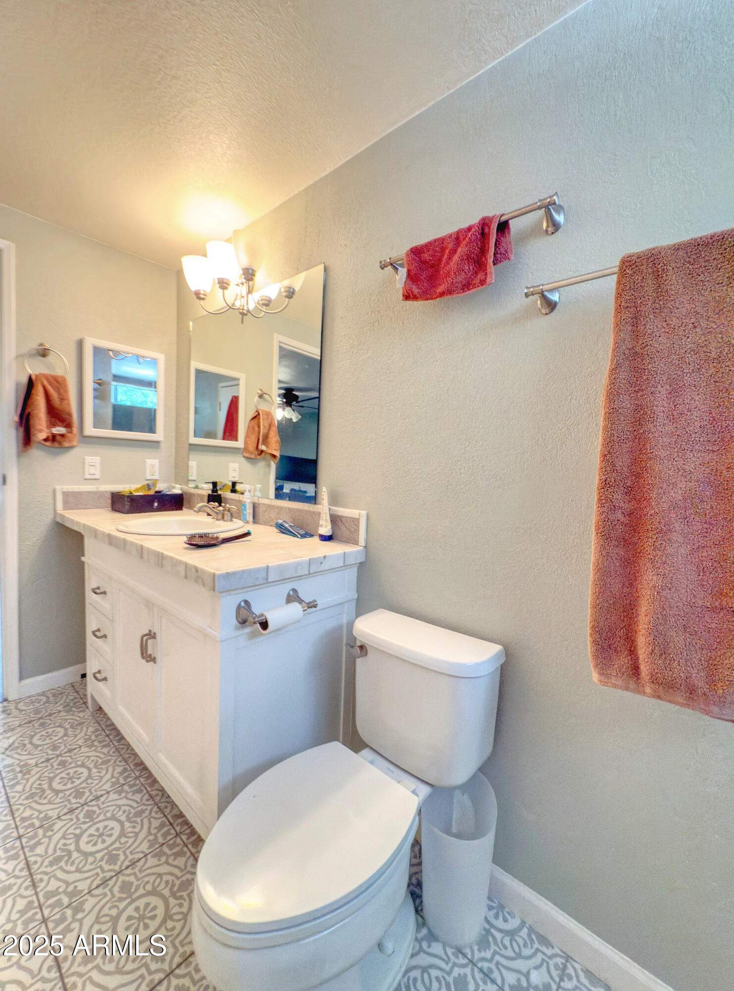 17090 Iron Springs Road Munds Park, AZ 86017 - Photo 34 of 68 a bathroom with a toilet sink and mirror