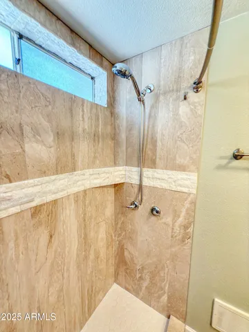 a view of a house with a yard and tree