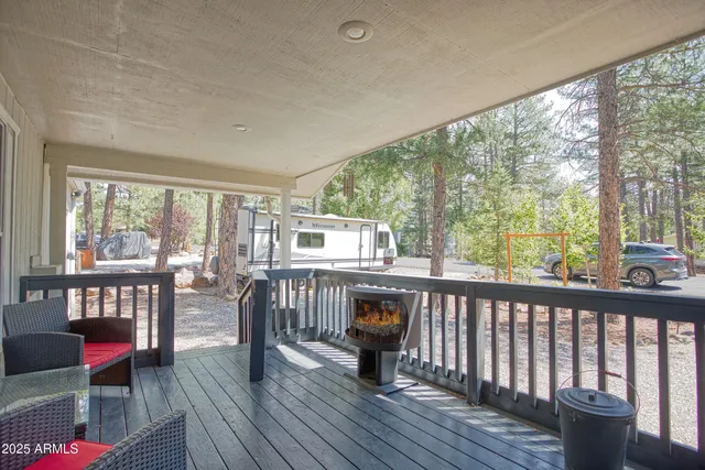 a view of a house with backyard and a tree