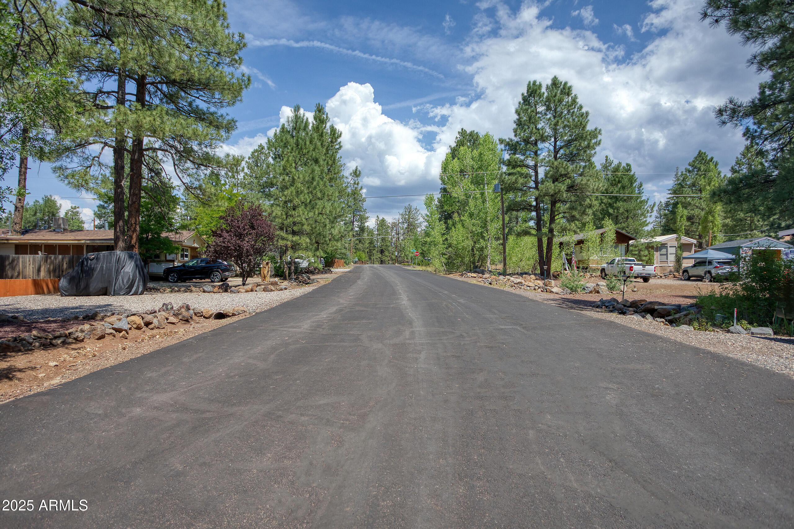 17090 Iron Springs Road Munds Park, AZ 86017 - Photo 55 of 68 a view of a road with a building in the background