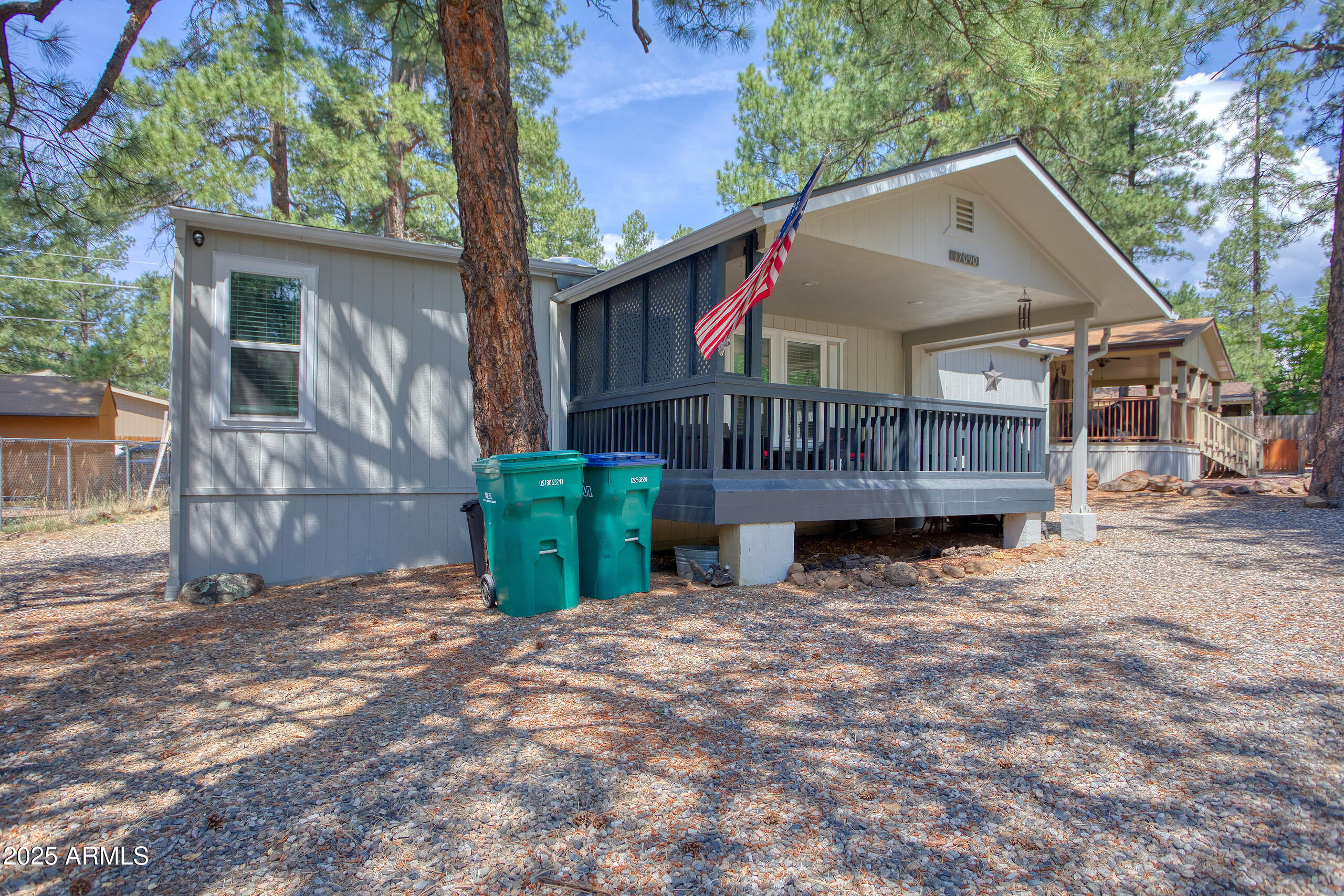 17090 Iron Springs Road Munds Park, AZ 86017 - Photo 60 of 68 a view of a house with wooden fence and a tree