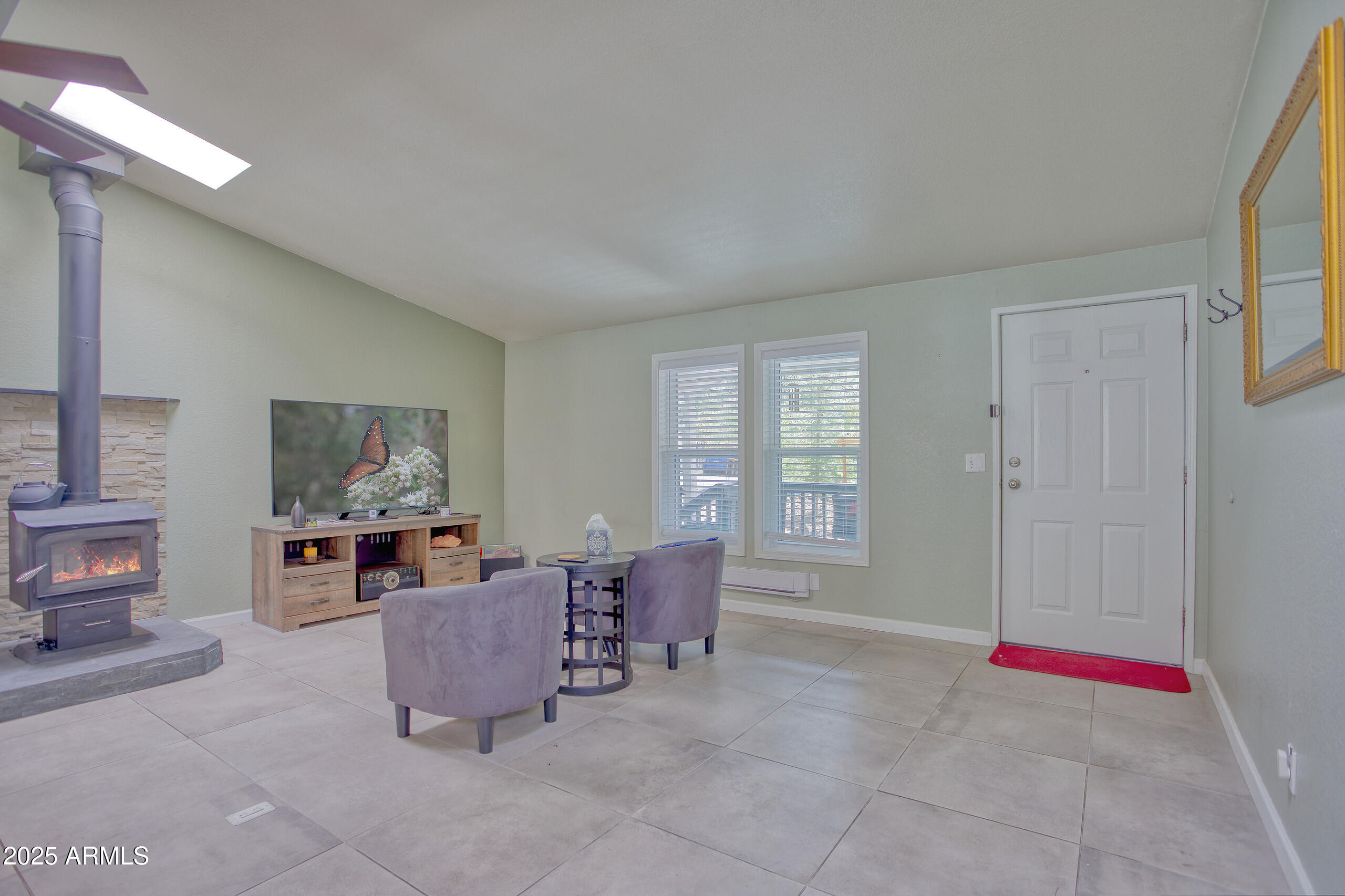 17090 Iron Springs Road Munds Park, AZ 86017 - Photo 7 of 68 a living room with furniture and large windows