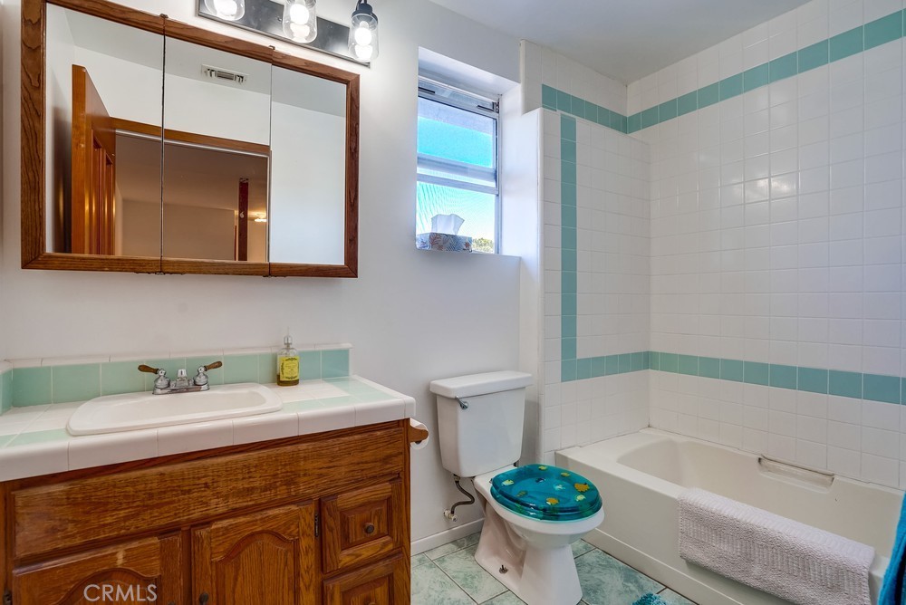 711 Marco Place Venice, CA 90291 - Photo 14 of 14 a bathroom with a sink a toilet and bathtub