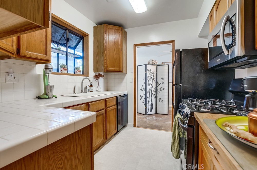 711 Marco Place Venice, CA 90291 - Photo 5 of 14 a view of a kitchen with a sink a washer and dryer
