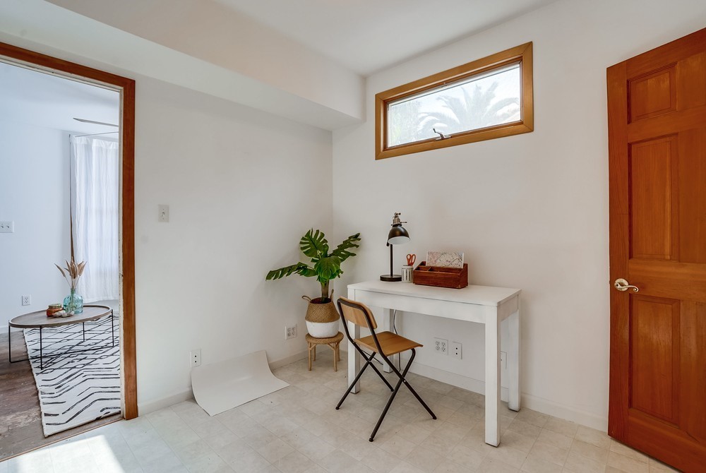 711 Marco Place Venice, CA 90291 - Photo 7 of 14 a workspace with furniture and a potted plant
