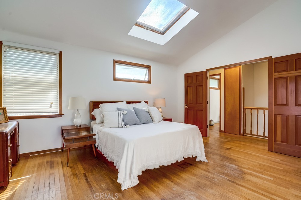 711 Marco Place Venice, CA 90291 - Photo 8 of 14 a bedroom with a large bed and a window