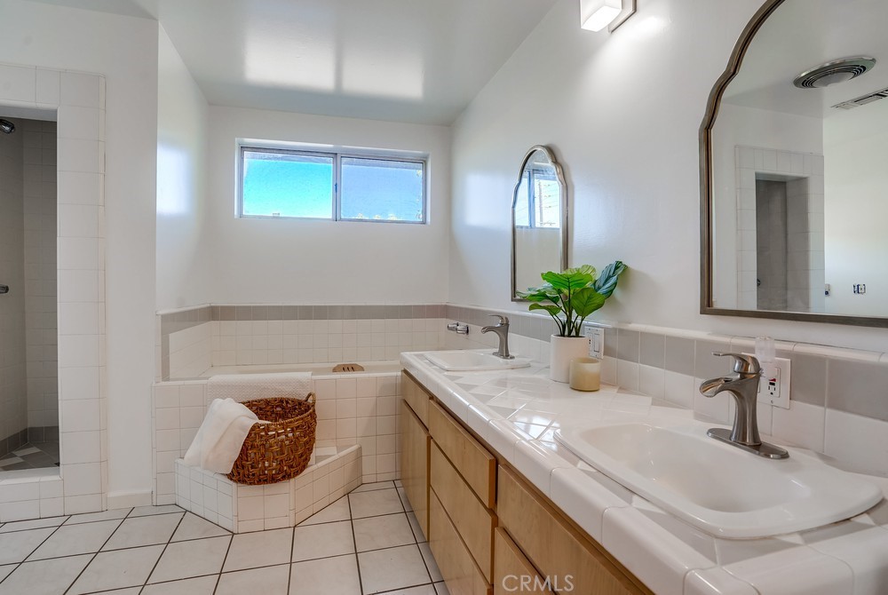 711 Marco Place Venice, CA 90291 - Photo 9 of 14 a bathroom with a sink and a mirror