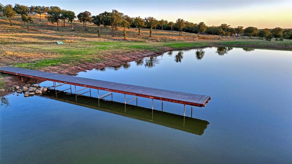 7441 Farm To Market 1956 Road Nocona, TX 76255 - Photo 17 of 40 a view of a lake with a big yard