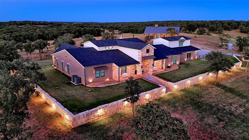 7441 Farm To Market 1956 Road Nocona, TX 76255 - Photo 3 of 40 an aerial view of a house with a garden