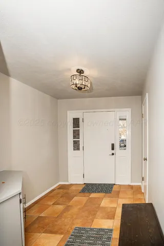 a view of a livingroom with wooden floor and a window