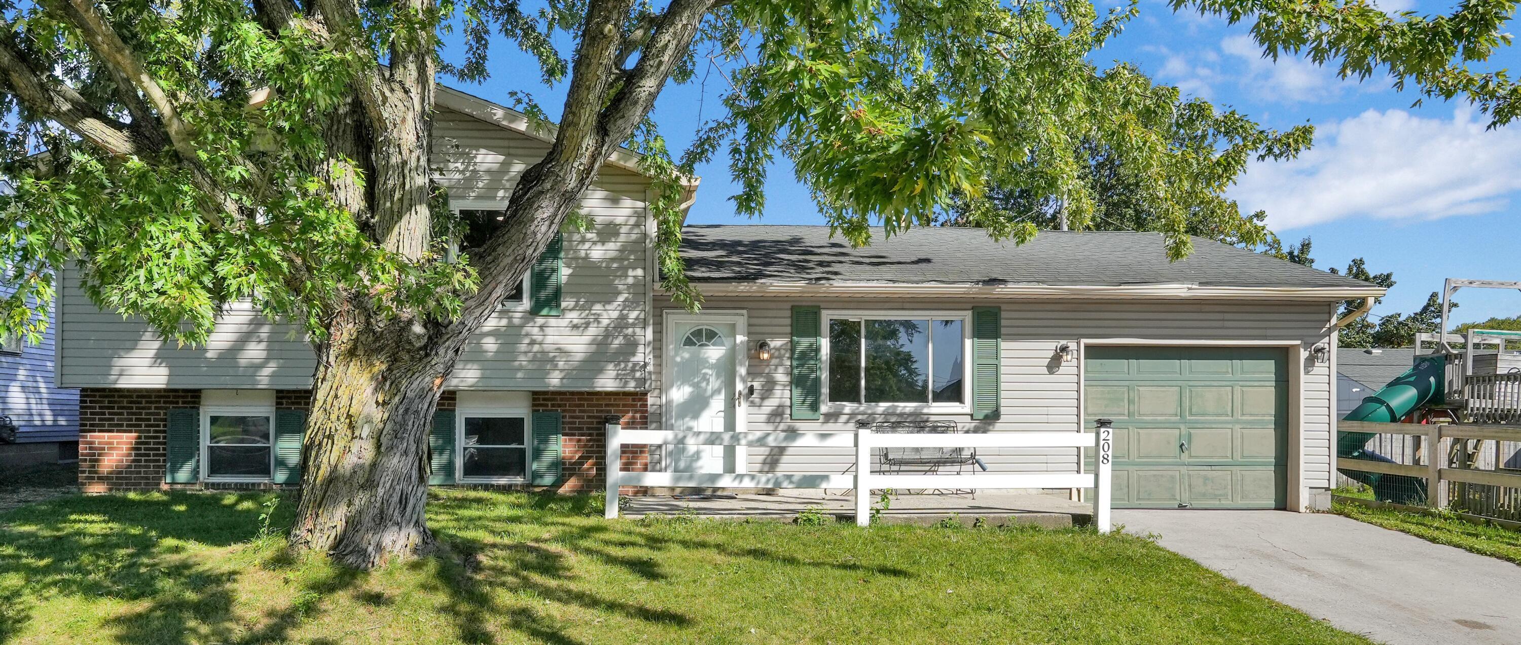 208 Cumberland Road Delaware, OH 43015 - Photo 1 of 37 Mature tree, white split-rail fence, lovely front patio...what a WONDERFUL place to spend your evenings!