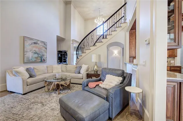 a living room with furniture and a painting