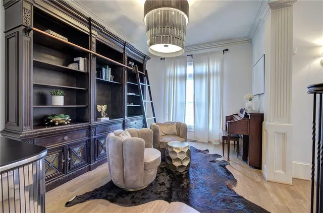 a living room with furniture a rug and a window