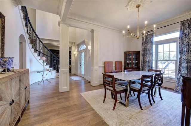 a living room with furniture and a stairs