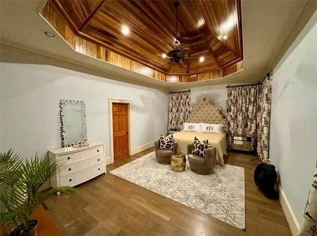 a spacious bathroom with a granite countertop sink a mirror and a bathtub
