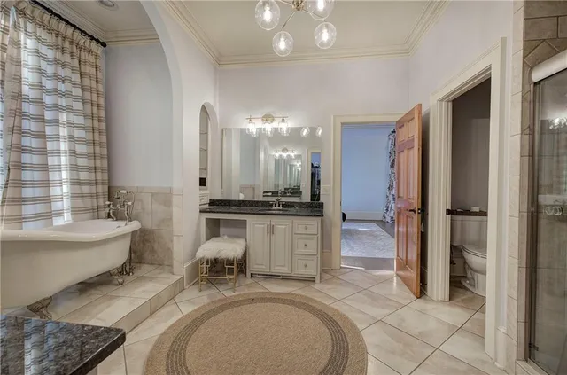 a bathroom with a glass shower door