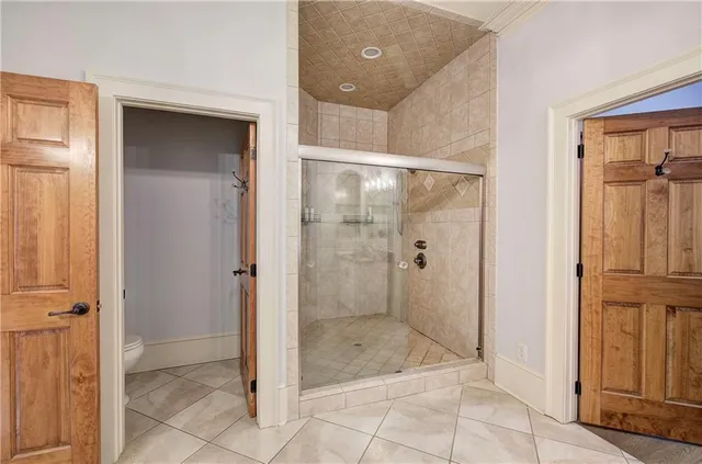 a spacious bathroom with sinks granite countertop tub and a large mirror