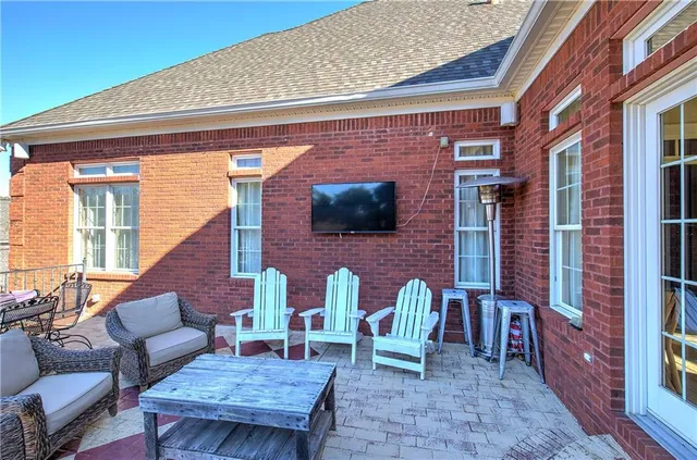 a front view of a house with yard and trees