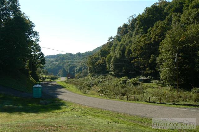 890 Virgil Greer Road Lansing, NC 28643 - Photo 1 of 1 a backyard of a house with lots of green space